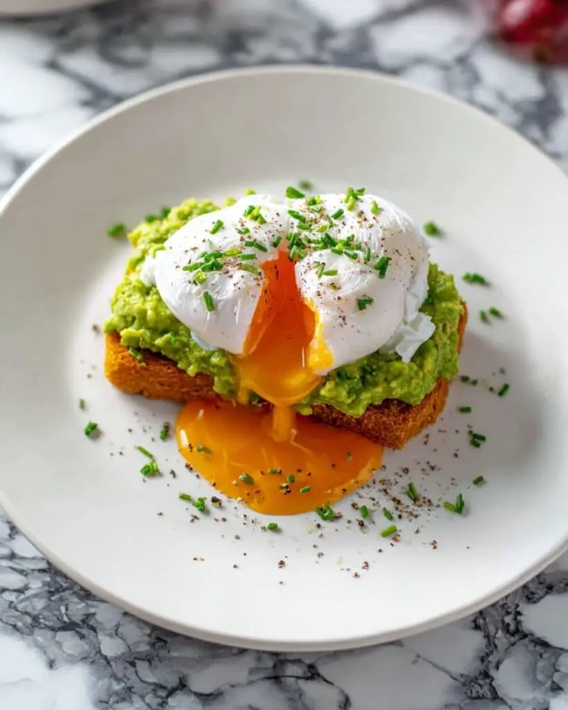 Hash Brown Avocado Toast with Poached Eggs and Chives Recipe