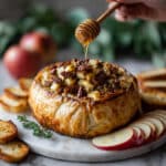 Baked Brie En Croute with Caramelized Apples, Pecans, and Honey Recipe