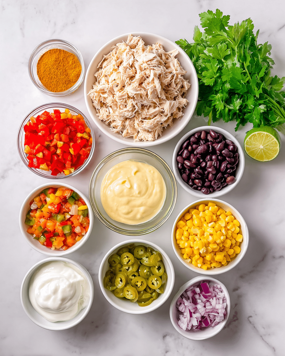 The image shows a collection of small white bowls and one white round plate placed on a white marbled surface. The largest white bowl, near the top center, holds shredded light brown chicken. Below it is a clear glass bowl filled with creamy pale yellow sauce, surrounded by smaller white bowls containing bright red chopped bell peppers on the left, orange chunky salsa to the right, vibrant yellow corn above, dark shiny black beans below the corn, and diced purple and white onions at the bottom right. There is a clear glass bowl with white sour cream near the bottom left, beside a white bowl holding chopped green pickles with liquid. Near the top left sits a small pile of orange-yellow curry powder and a whole lime. A bunch of fresh green parsley rests on the top right side of the bowls. The layout is neat, colorful, and visually appealing, with varied textures from creamy to chunky and fresh herbs visible. Photo taken with an iphone --ar 4:5 --v 7