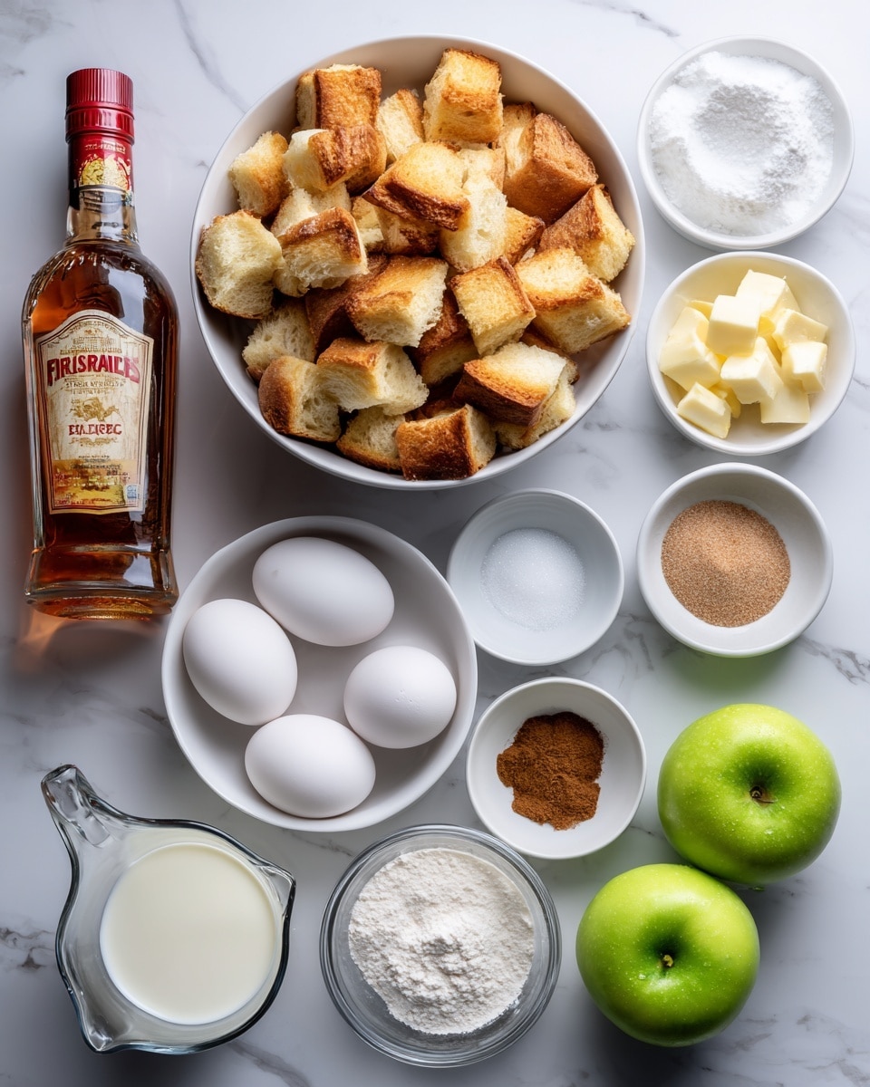 The image shows all the ingredients neatly arranged on a white marbled surface, ready for a recipe. At the top center, there is a white bowl filled with golden-brown brioche bread cubes. To the right of the bowl, there are small white bowls containing salted butter, cinnamon powder, heavy cream, and brown sugar arranged from top to bottom. Below them are separate white dishes holding sugar and vanilla extract. Near the center, a white bowl holds four white eggs. On the left side, there is a large bottle of Fireball cinnamon whisky standing upright. At the bottom left, a clear glass measuring cup is filled with whole milk. On the bottom right, two bright green Granny Smith apples rest side by side. The ingredients are spaced evenly with clear labels above or next to each item, all placed on the white marbled surface photo taken with an iphone --ar 4:5 --v 7