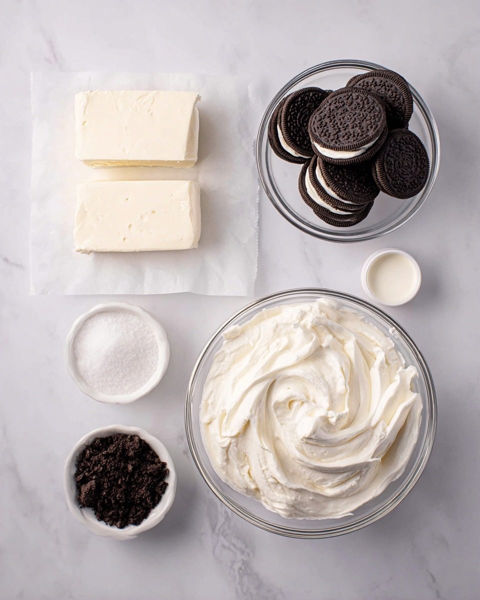 The image shows several ingredients on a white marbled surface arranged neatly. On the top left, there are two thick blocks of pale cream cheese on a white paper. To the right, a clear glass bowl is filled with whole black and white sandwich cookies stacked randomly. Below, a large clear glass bowl contains smooth, thick whipped cream with visible swirls. On the bottom left, a small white bowl holds dark chocolate cookie crumbs. To the right of that, another small white bowl is filled with white granulated sugar, and above it, a tiny white cup holds a small amount of cream. The colors are mostly white, black, and cream, creating a simple and clean look, photo taken with an iphone --ar 4:5 --v 7