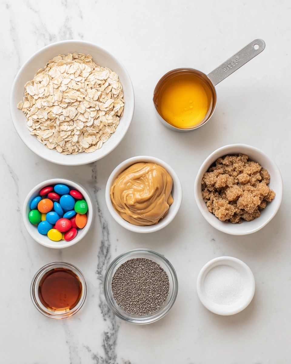 The image shows seven white bowls and one metal measuring cup arranged on a white marbled surface, each holding different ingredients. Starting from the top left, there is a bowl filled with light beige rolled oats, next to it on the right is a metal measuring cup with a silver handle filled with golden honey. Below the oats, a small bowl holds colorful candy-coated chocolates in bright red, blue, yellow, and brown. To the right of the candy, a bowl contains light to dark brown packed brown sugar with a crumbly texture. In the center bottom row, a clear glass bowl holds smooth and creamy peanut butter in tan color. On the bottom left, a small bowl contains dark amber liquid vanilla extract. To the right, a small bowl shows tiny gray chia seeds. Lastly, in the bottom right corner, a small white bowl contains fine white salt. Photo taken with an iphone --ar 4:5 --v 7