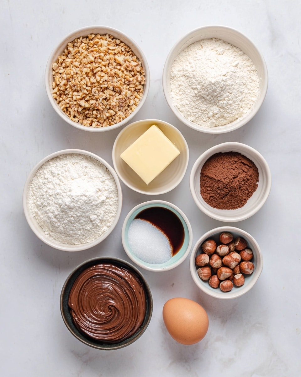 The image shows nine small white bowls and one egg arranged on a white marbled surface. Starting from the top left, there is a bowl filled with finely chopped nuts with a light brown color and coarse texture. To its right, there is a bowl with white flour that looks soft and powdery. Below the nuts, there is a bowl with a pale yellow square of butter with a smooth texture. Next to the flour bowl, on the right, there is a white bowl filled with fine white powder, likely powdered sugar. Below that is a smaller bowl filled with cocoa powder, dark brown and powdery. To the left of the cocoa powder is a white bowl with granulated white sugar. Below the sugar is a small white bowl filled with dark brown vanilla extract, smooth and shiny. Below the vanilla extract bowl is a small white bowl with white salt crystals. Below the nuts and butter, there is a black bowl with smooth, swirled chocolate spread in a dark brown color. There is a light brown egg near the salt bowl and a small pile of whole hazelnuts beside the egg. Photo taken with an iphone --ar 4:5 --v 7
