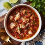 Hearty Fish Soup with Tomatoes, Red Peppers, and Fresh Herbs Recipe