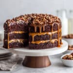 Decadent Turtle Cake with Caramel, Pecan Garnish, and Rich Chocolate Ganache Recipe