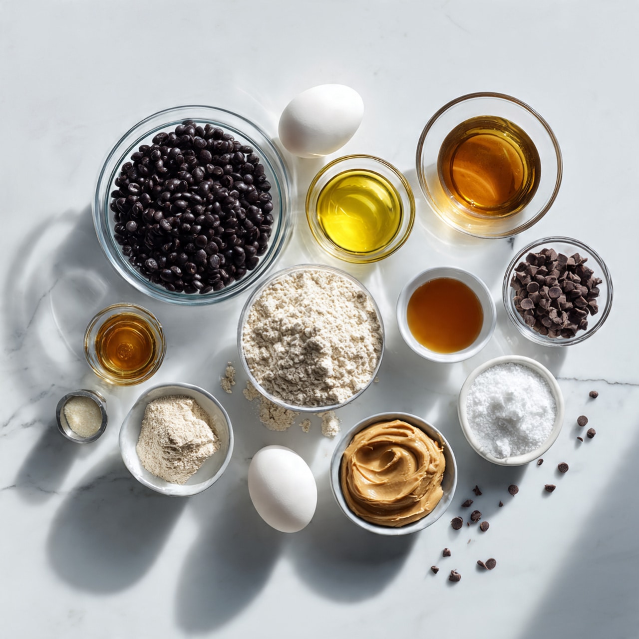 A stack of three dark chocolate cookies with chunks and chips visible on top sits on a white plate. The top two cookies are broken, showing a smooth, light caramel filling oozing out from inside. The plate rests on a beige cloth on a dark textured surface. Scattered chocolate chips are around the plate, and there is a blurred glass of white milk and a small white bowl filled with chocolate chips in the background. Photo taken with an iphone --ar 4:5 --v 7