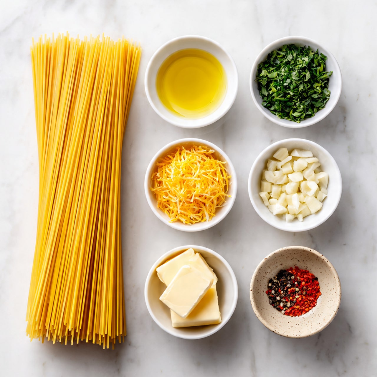 The image shows a group of ingredients neatly placed on a white marbled surface. On the left side, there is a bundle of long, uncooked yellow spaghetti sticks aligned vertically. To the right of the spaghetti, there are seven small white bowls arranged in three rows. The top row has two bowls: one with clear olive oil, and the other with chopped green herbs. The middle row has three bowls: one with orange-yellow lemon zest, one filled with small round green capers, and one with soft pale yellow butter. The bottom row has two small bowls: one with chopped light garlic and the other two small speckled beige bowls with black pepper and red chili flakes. All the elements are displayed clearly in a clean and orderly fashion, photo taken with an iphone --ar 4:5 --v 7