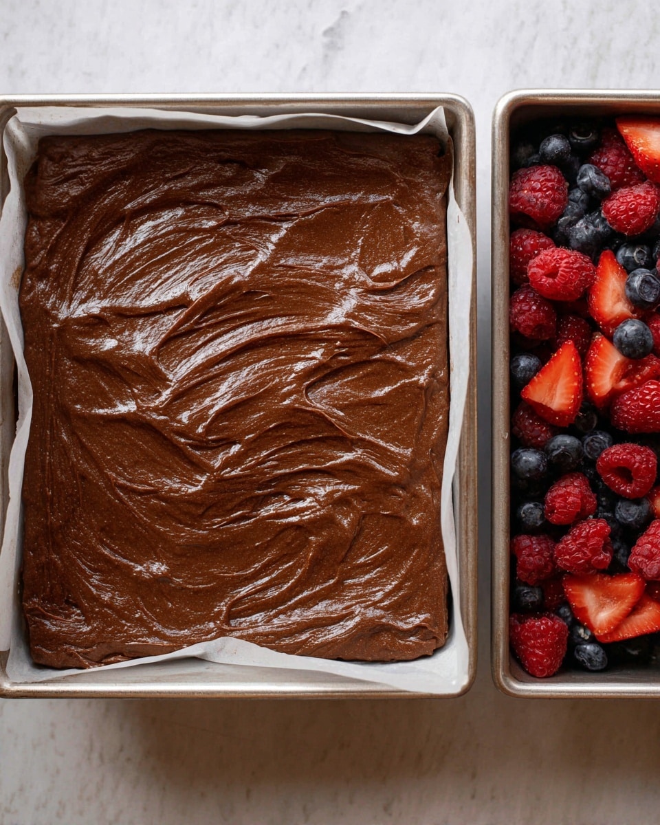 The image shows three main items on a white marbled surface: in the top left, a white baking pan filled with many small, square, dark brown brownie pieces; to the top right, a white bowl containing fresh red strawberries sliced, whole red raspberries, and small dark blue blueberries; at the bottom center, a large clear glass mixing bowl filled with smooth, thick white whipped cream with soft peaks and swirls visible on the surface. Photo taken with an iphone --ar 4:5 --v 7