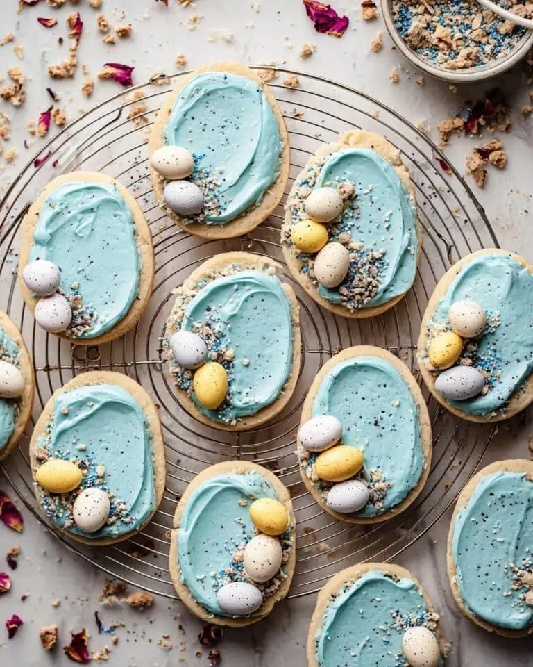 Frosted Egg-Shaped Cookies with Speckled Vanilla Buttercream and Cadbury Mini Eggs Recipe
