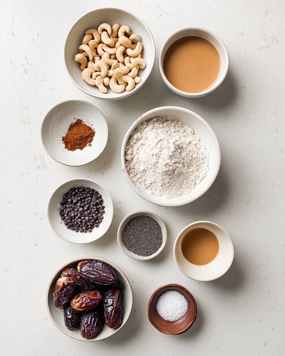 A top-down view of eleven white bowls arranged in a loose grid pattern on a white marbled surface, each bowl holding a different ingredient: whole cashews in a bowl at the top, below it a larger bowl filled with white flour. To the left of the flour bowl, a small bowl holds ground cinnamon, while to the right a small empty bowl is visible. Below these, a white bowl contains several dark brown dates, and next to it a small bowl has black chia seeds. Further down, there is a bowl with dark chocolate chips on the left and a bowl with a light brown liquid in the center. On the bottom left, a bowl filled with light brown peanut butter and to the right, a small brown bowl filled with salt completes the arrangement, all placed neatly on the white marbled surface photo taken with an iphone --ar 4:5 --v 7