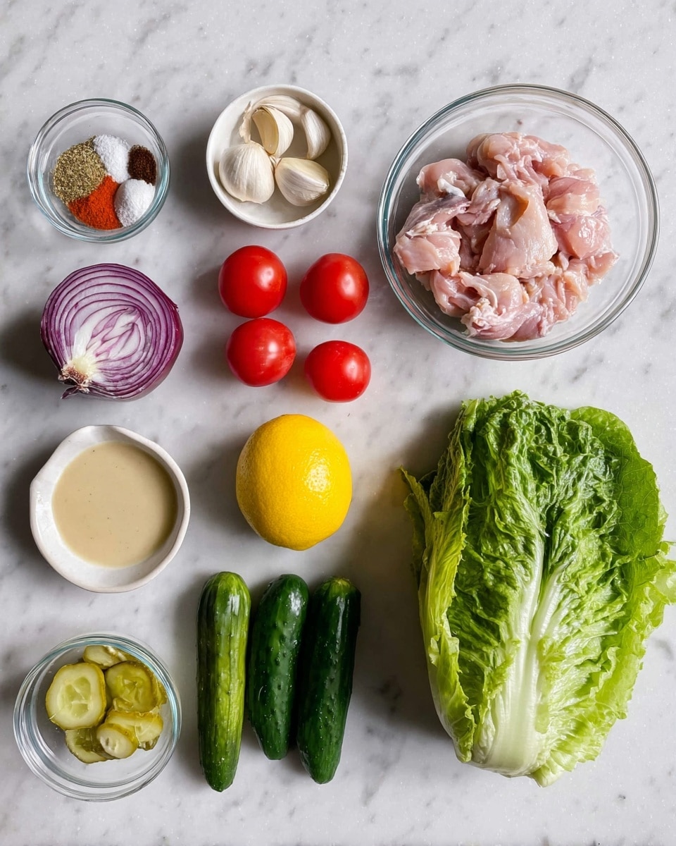 The image shows various fresh ingredients arranged neatly on a white marbled surface. There is a large green lettuce head on the right, with dark green leafy leaves and white stems. Next to it are two small bright green cucumbers. A whole yellow lemon is placed centrally, surrounded by three small red tomatoes on the left side. Whole garlic cloves rest in a small clear glass bowl just below the lemon. Above the lemon is a clear bowl filled with raw light pink chicken pieces. To the upper left, a small white bowl holds a mix of colorful spices including red, white, brown, and orange powders. A small glass bowl of a creamy beige liquid is located in the bottom left corner, and beside it is another small glass bowl containing pale green sliced pickles. A whole purple-red onion is seen in the top left corner. All ingredients are spread out with enough space, making each item clearly visible. Photo taken with an iphone --ar 4:5 --v 7