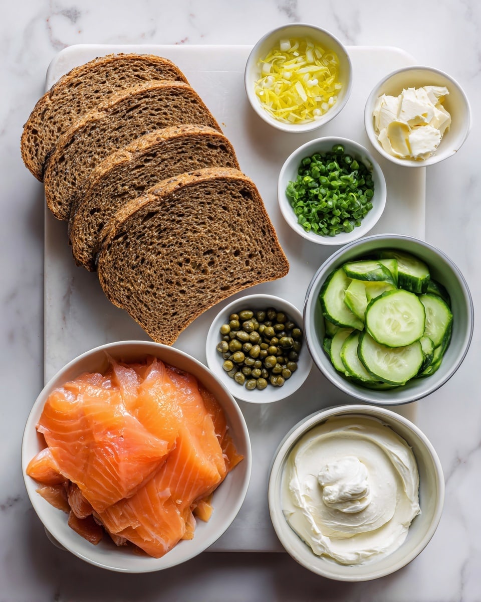 The image shows ingredients laid out on a white marbled surface, centered around six slices of brown rye bread placed in a slight overlapping stack on a white marble cutting board. To the lower left of the bread, there is a white bowl filled with bright orange smoked salmon, thinly sliced with a smooth texture. Above that, small bowls hold green capers, dark green dill, bright yellow lemon zest, pale yellow lemon juice, and chopped green scallions. On the right side of the bread, a small white bowl contains off-white horseradish, and a larger white bowl next to it has creamy white cream cheese with a soft, swirled texture. Below those, another white bowl holds pale green cucumber slices, thin and evenly cut in a neat stack. The overall arrangement is clean and simple with a fresh, natural look, and a woman's hand is not in the image. Photo taken with an iphone --ar 4:5 --v 7