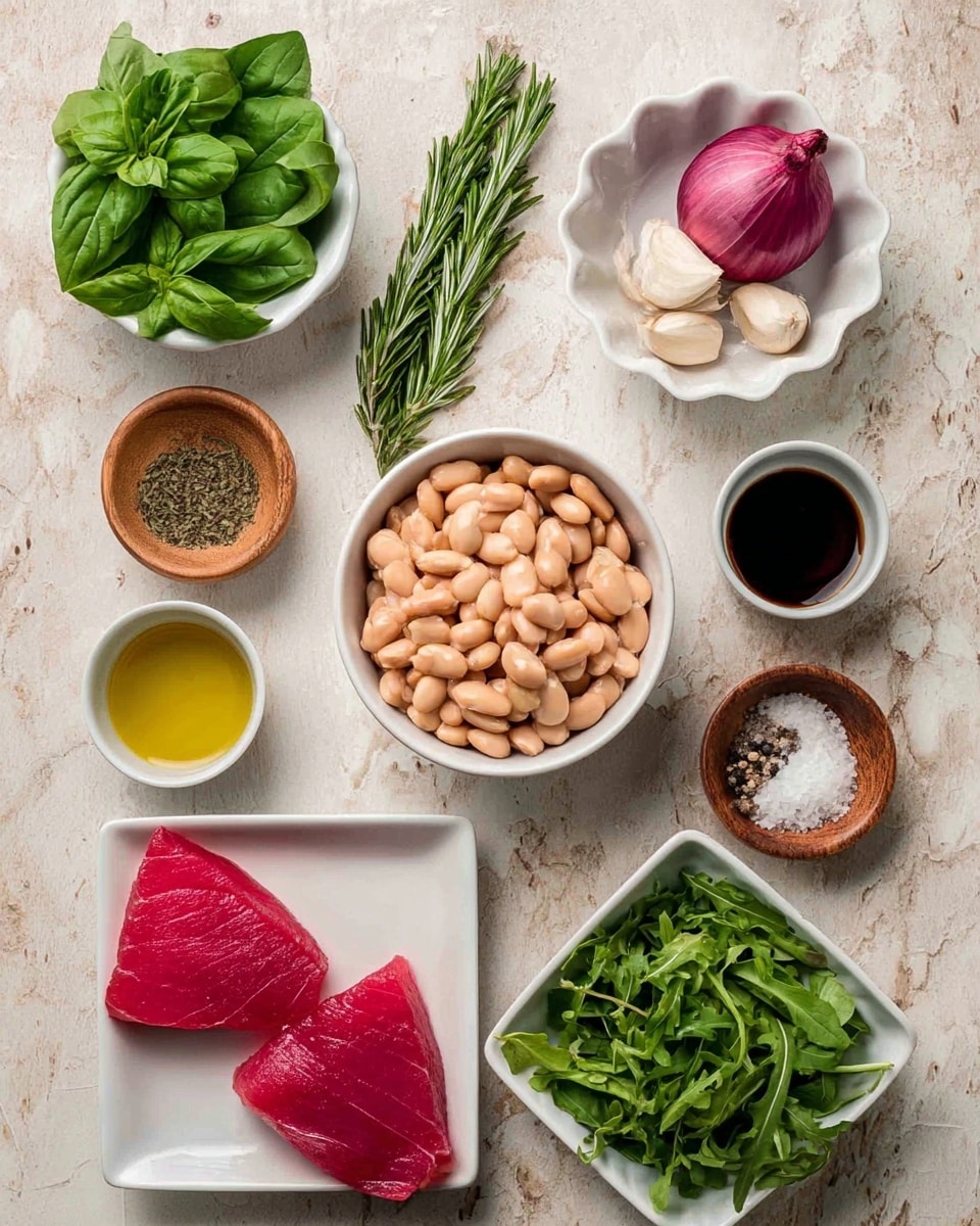 The image shows nine ingredients arranged neatly on a white marbled surface. Starting from the top left, a small white bowl holds fresh green basil leaves, next to it two sprigs of green rosemary lie flat. To the right, a small white scalloped bowl contains two halves of purple shallot and two white garlic cloves. In the center, a medium white bowl is filled with beige cannellini beans. Nearby, two small white cups hold golden olive oil and dark red vinegar. On the bottom left, two bright red raw tuna steaks sit on a small white square plate. To their right, two small wooden bowls hold coarse salt and cracked black pepper. Finally, a medium white bowl contains fresh green arugula leaves. Photo taken with an iphone --ar 4:5 --v 7