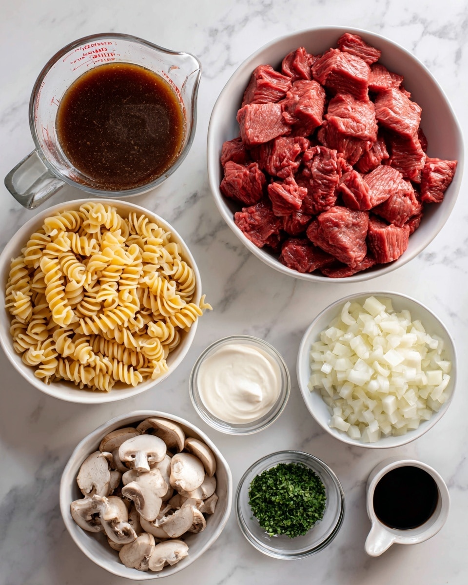 The image shows an overhead view of several white bowls and clear containers on a white marbled surface, each holding different raw ingredients for cooking. In the center is a large white bowl filled with chunky, raw red stew meat. To its upper left is a clear glass measuring cup filled with dark brown broth. Below the meat bowl is a large white bowl full of uncooked spiral pasta, golden yellow in color and tightly packed. To the right of the pasta is a clear glass cup holding white cream. Near the bottom middle is a small white cup of finely chopped garlic. Moving to the right and above, a medium white bowl contains halved and sliced brown and white mushrooms. Next to it is another white bowl with diced white onion pieces. Above the onion is a small white plate with green mixed herbs in a fine texture. Below the herbs, a half-opened can shows thick white condensed soup. Finally, a small white dish at the bottom right holds dark Worcestershire sauce. The overall look is neat and organized, with each ingredient clearly visible. Photo taken with an iphone --ar 4:5 --v 7