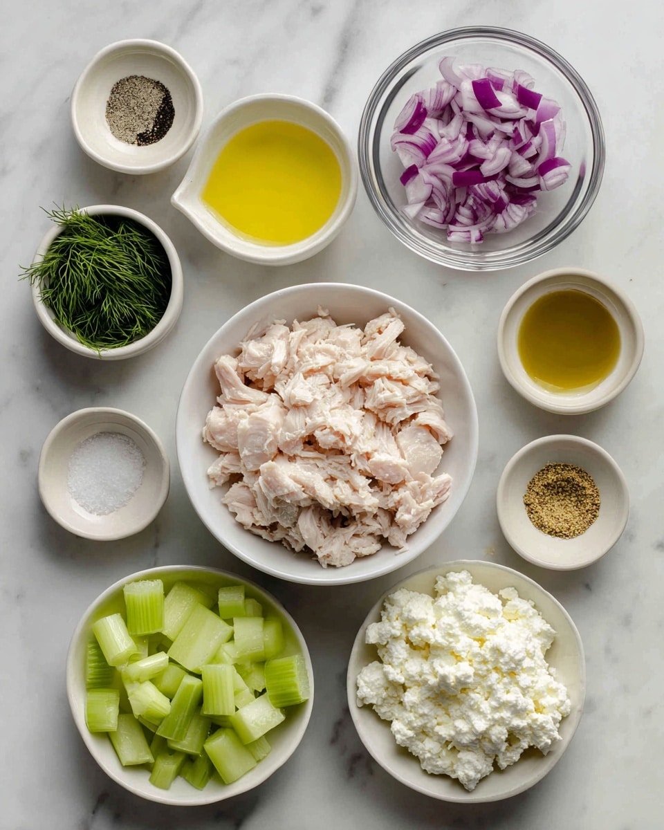 The image shows a white marbled surface with eleven small white bowls arranged in a loose cluster. The largest bowl in the center holds chopped cooked chicken, light pink and white in color with a chunky texture. Above it, a clear glass bowl contains finely chopped red onions with a vivid purple shade. To the right, a white bowl is filled with white cottage cheese that looks soft and lumpy. Next to that, small white bowls hold pale yellow lemon juice, olive oil with a rich yellow tone, and grainy brown dijon mustard. Below those, diced celery with bright green color is in another white bowl. Small bowls on the left contain salt with white crystals, fresh green dill, black pepper, and a little white sugar, all sitting neatly on the white marbled background. photo taken with an iphone --ar 4:5 --v 7