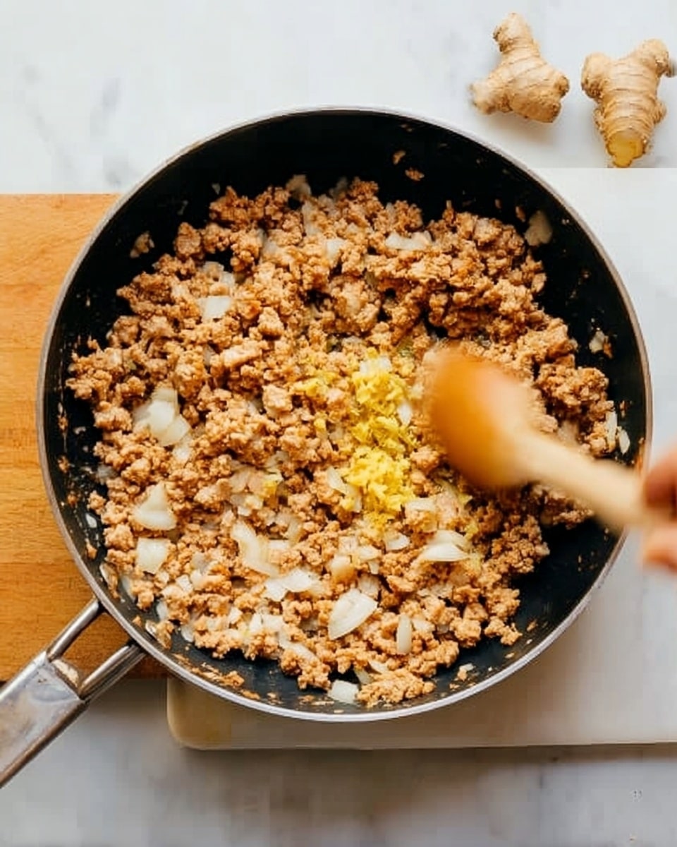 The image shows various fresh ingredients arranged neatly on a white marbled surface. At the top center, a clear square container holds cooked ground chicken with green onion pieces on top. To its right, an empty clear round bowl has bright orange shredded carrots. Below the chicken and carrots, fresh green cilantro leaves are placed on the surface. Below cilantro, thin green cucumber slices are arranged on a small wooden board next to a large wedge of pale green cabbage. To the left of the cabbage, two green onion stalks lie flat. Below this, a small clear bowl filled with thick dark brown hoisin peanut sauce sits beside a small white bowl of light brown peanuts and a bowl of shredded white coconut. Near the center of the arrangement is a white egg next to a small clear jar filled with white sesame seeds. To the right, a small clear bowl contains bright green edamame, and next to it is a small white bowl of light brown wonton strips. Everything is placed against the clean white marbled background. photo taken with an iphone --ar 4:5 --v 7