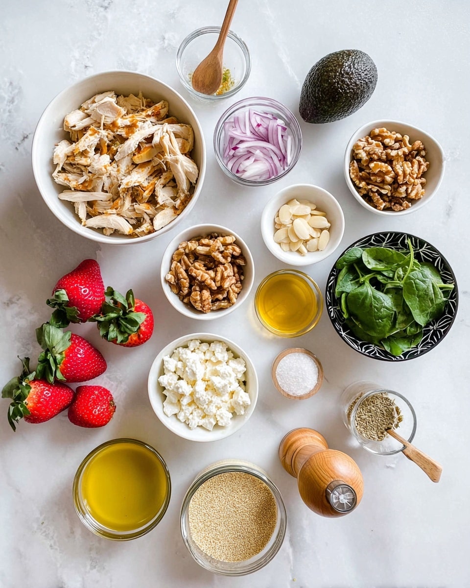 The image shows an overhead view of various ingredients laid out on a white marbled surface. There is a large white bowl filled with shredded light brown cooked chicken pieces on the left center. Above it, a small white bowl holds sliced purple onions, and next to it is a small clear glass with a wooden spoon resting inside, filled with a light brown powder. To the right, three medium white bowls contain chopped walnuts, sliced almonds, and fresh green leafy spinach. A black bowl with white designs holds white crumbled cheese. Scattered around are five bright red strawberries with green leaves. Below the chicken bowl, a clear glass container with yellow dressing or oil is visible, along with a small glass bowl of yellow mustard, a small white bowl with a golden liquid, and a glass bowl filled with grainy mustard. A whole dark green avocado and a wooden pepper grinder are also placed on the surface. A small white bowl with white salt and a small gold spoon sit beside the pepper grinder. Photo taken with an iphone --ar 4:5 --v 7