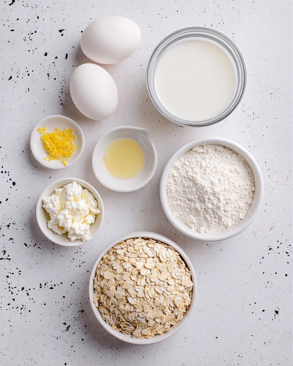 The image shows seven ingredients placed on a white marbled surface with black speckles. At the top left, there are two white eggs lying side by side. Below the eggs is a clear glass bowl filled with white milk. Near the center, two small white bowls hold a small amount of water and yellow lemon zest, respectively. On the right side, there is a white bowl with white flour and next to it, a white bowl containing white cottage cheese. At the bottom right, a white bowl is filled with light beige rolled oats. The arrangement is neat and the colors are soft and natural. Photo taken with an iphone --ar 4:5 --v 7