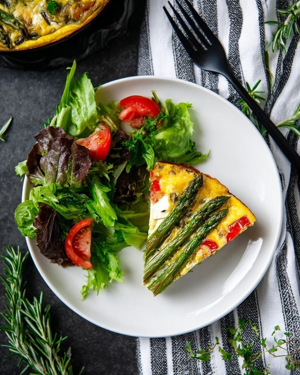 A white plate holds a slice of vegetable frittata and a fresh green salad. The slice has three visible layers: a golden yellow egg base, mixed with white cheese patches; on top are bright green asparagus spears arranged diagonally, and red bell pepper pieces adding color contrast. Beside it, the salad includes dark green romaine and leaf lettuce with bright red tomato wedges, garnished with fresh parsley sprigs. The plate sits on a dark background with a white and black striped cloth nearby, and a black fork on the top right. Sprigs of rosemary are scattered around the scene. Photo taken with an iphone --ar 4:5 --v 7