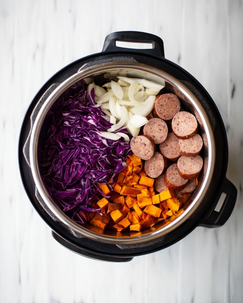 A top view of an open black pressure cooker on a white marbled surface showing four separate layers of ingredients inside. The bottom right layer has round slices of light brown sausage, the bottom left layer consists of shredded purple cabbage with white streaks, the top right layer has small orange cubes of sweet potato, and the top left layer includes light white sliced onions with a smooth texture. photo taken with an iphone --ar 4:5 --v 7