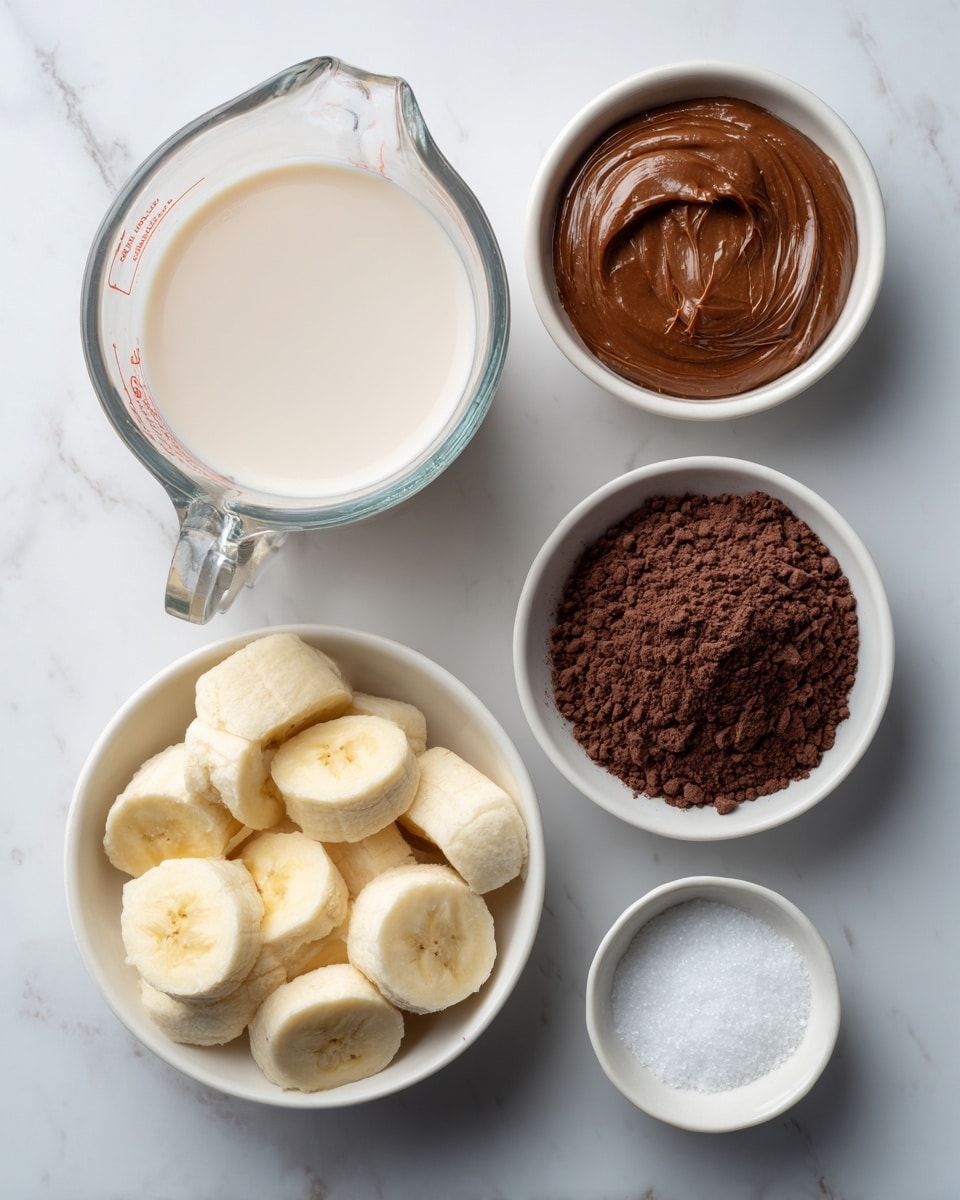 The image shows five separate containers with ingredients arranged on a white marbled surface. In the center left, there is a clear glass measuring cup filled with smooth, light beige almond milk. To its top right, a small white bowl holds shiny, rich brown almond butter with visible creamy texture. Below that, another small white bowl contains dark brown cocoa powder with a slightly coarse texture. At the bottom left, a white bowl is filled with sliced banana pieces that are pale yellow and look soft. Finally, near the bottom right, a small white bowl contains fine white salt. All are spaced evenly with clear labels on each container. Photo taken with an iphone --ar 4:5 --v 7