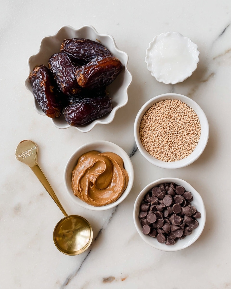 The image shows six small containers arranged on a white marbled surface. At the top left, a white scalloped bowl holds a cluster of dark brown dates with shiny, wrinkled skin. To its right, a small white bowl contains a white, creamy solid resembling coconut oil. Below, on the right side, a white bowl is filled with light tan, small round seeds or grains. On the bottom left, a gold measuring spoon labeled 1/4 cup holds smooth, light brown almond butter. Next to it on the right, another gold measuring spoon labeled 1/3 cup is filled with dark brown chocolate chips with a glossy texture. The layout presents a clear view of each ingredient from above. photo taken with an iphone --ar 4:5 --v 7