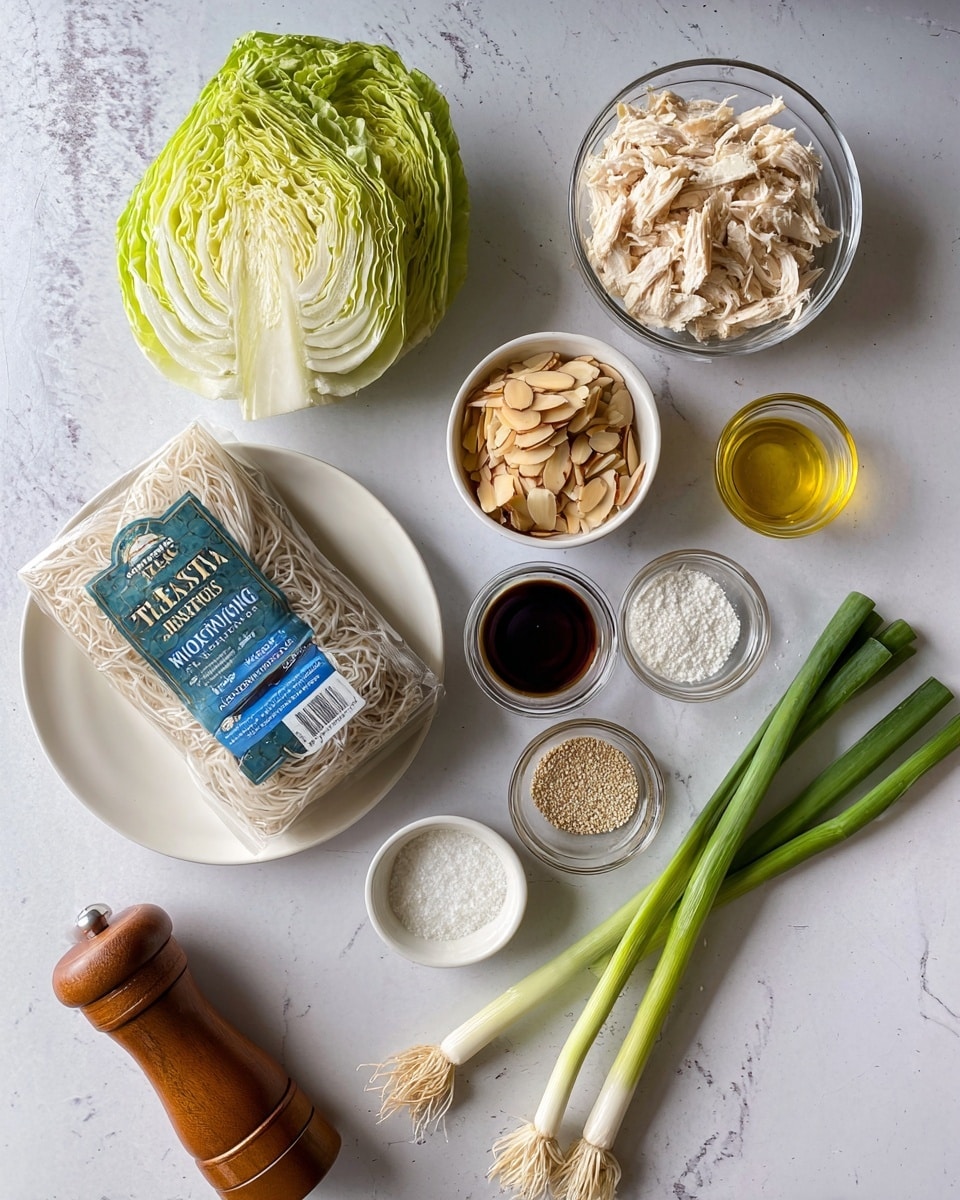 The image shows fresh ingredients for a dish on a white marbled surface. On the top left is half a green iceberg lettuce with its layered leaves visible. Next to it on the top right is a clear glass bowl filled with shredded cooked chicken, light beige in color. Below the chicken is a small white bowl with sliced almonds, light brown with toasted edges. To the right of the almonds is a small glass cup with a golden liquid, likely oil. Below the oil are three small glass bowls with white sesame seeds, dark soy sauce, and clear vinegar. In the middle left is a large white plate holding a package of Taste of Thai angel hair rice noodles, wrapped in clear plastic with a blue label. To the right of the package are four long green onions with white bulbs and green tops resting diagonally. Below the onions is a small white bowl of white salt. At the bottom left is a wooden pepper grinder with its lid off showing black pepper inside. Lastly, near the grinder is a small glass bowl filled with a white powder, possibly garlic powder. The arrangement is neat, showing a variety of textures and colors on the white marbled surface. photo taken with an iphone --ar 4:5 --v 7