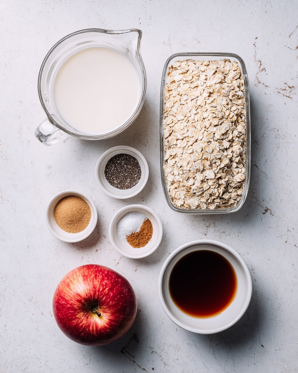 A top-down view shows several ingredients on a white marbled surface. There is a large clear glass measuring cup filled with white milk at the top center. To the right is a clear rectangular glass container filled with steel cut oats, light tan in color and coarse in texture. Below the measuring cup, there are three small white bowls: one with black and white chia seeds, one with warm brown cinnamon powder mixed with a small amount of white salt, and one with dark brown vanilla extract liquid. Next to these is a round white bowl filled with light brown packed brown sugar. At the bottom left corner lies a whole red apple with a shiny skin. All ingredients are arranged neatly and clearly labeled. Photo taken with an iphone --ar 4:5 --v 7