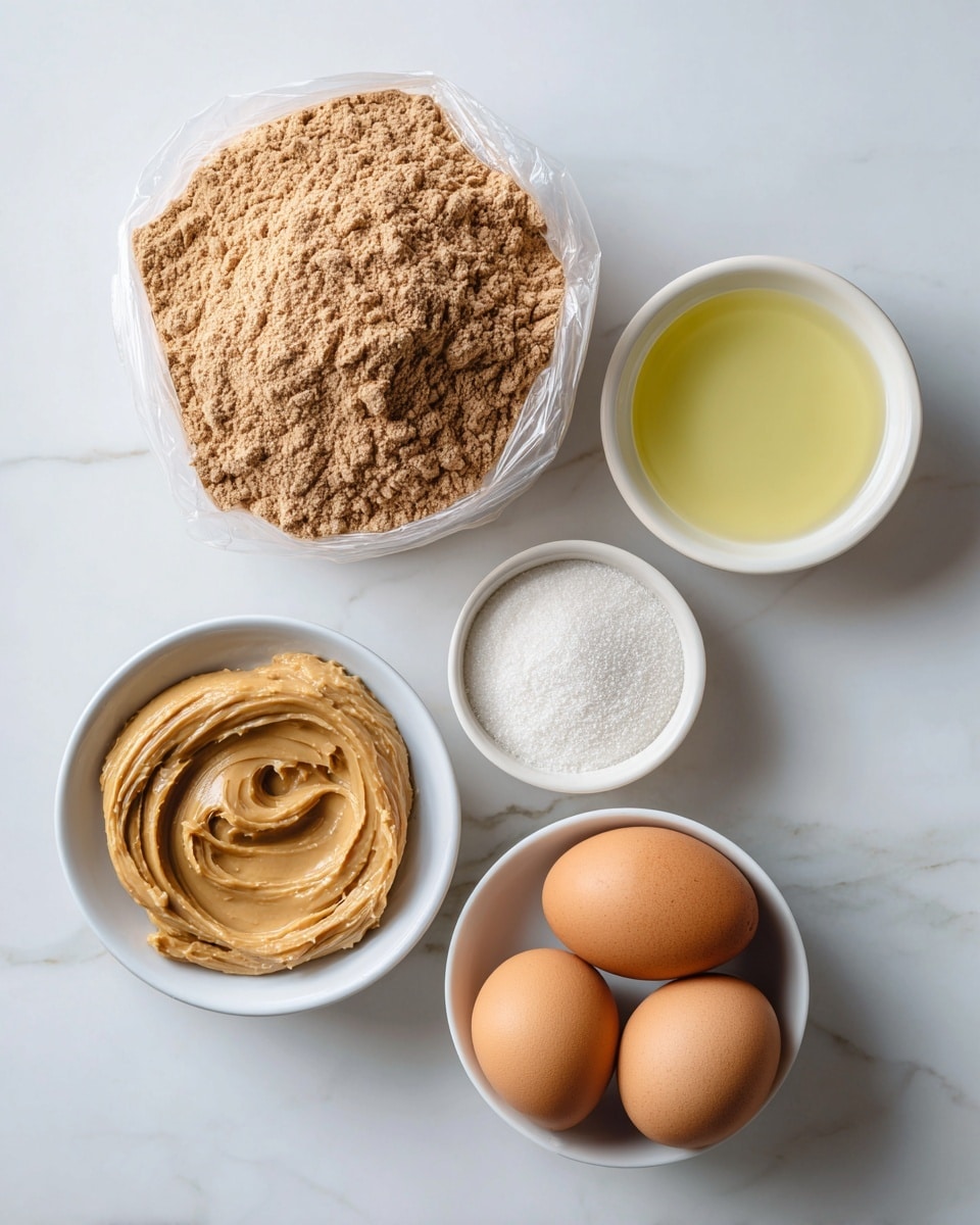 The image shows five ingredients arranged on a white marbled surface. On the top left is a clear plastic bag filled with light brown chocolate cake mix powder, labeled clearly. To the right of it, a small white bowl holds a pale yellow oil with a smooth texture. Below the chocolate mix and oil, a white bowl is filled with a creamy, light brown peanut butter. To the bottom left, a white bowl holds fine white granulated sugar, and to the right of it, a white bowl contains two brown eggs with smooth shells. All items are spaced evenly and viewed from above. Photo taken with an iphone --ar 4:5 --v 7