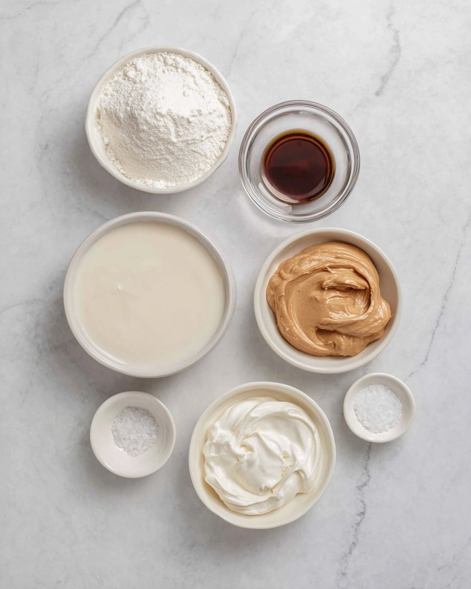 The image shows seven small white bowls arranged on a white marbled surface. The largest bowl at the bottom left holds a smooth, creamy white liquid. To its right, a smaller bowl contains thick, white cream with a smooth texture. Above them, in the center right, there is a bowl filled with a smooth, light brown peanut butter-like spread. At the top center is a bowl filled with fine white powder. To the right of it is a small clear glass bowl holding a small amount of dark brown liquid. Below that, a small white bowl contains coarse white salt or sugar crystals. Another tiny white bowl with a small amount of finer white powder sits just below the top left bowl. All bowls are placed neatly, with soft lighting and clear details. Photo taken with an iphone --ar 4:5 --v 7