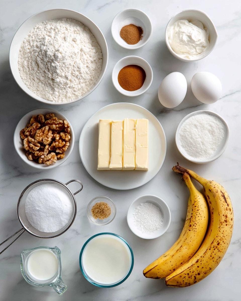 A rectangular loaf of golden brown banana bread sits inside a dark loaf pan lined with light parchment paper that folds up on both longer sides, showing a slightly cracked and textured crust with darker brown spots. The loaf pan rests on a white marbled surface. The bread looks moist and soft with a slightly uneven surface that hints at the fresh baking. photo taken with an iphone --ar 4:5 --v 7