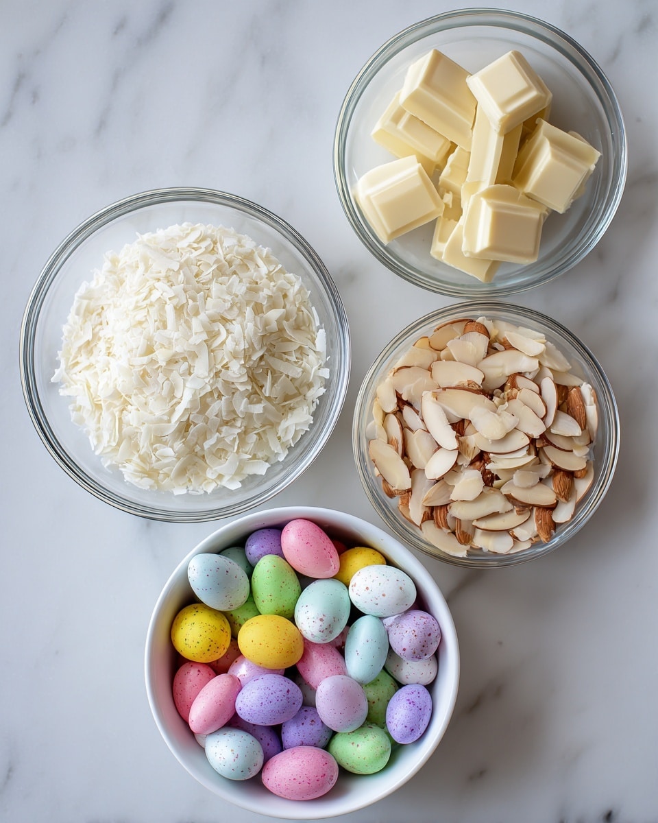 The image shows four clear glass bowls on a white marbled surface. The top right bowl contains pieces of white and milk chocolate, broken into small chunks with smooth edges. Below it, a bowl is filled with fine, white shredded coconut that looks soft and fluffy. On the left, a bowl holds pale beige sliced almonds that are thin and slightly curved. At the bottom, there is a larger white bowl filled with many small, colorful mini eggs in pastel colors like yellow, pink, green, blue, purple, and white, each speckled with tiny darker spots. The overall look is clean and neat with a soft natural light. Photo taken with an iphone --ar 4:5 --v 7