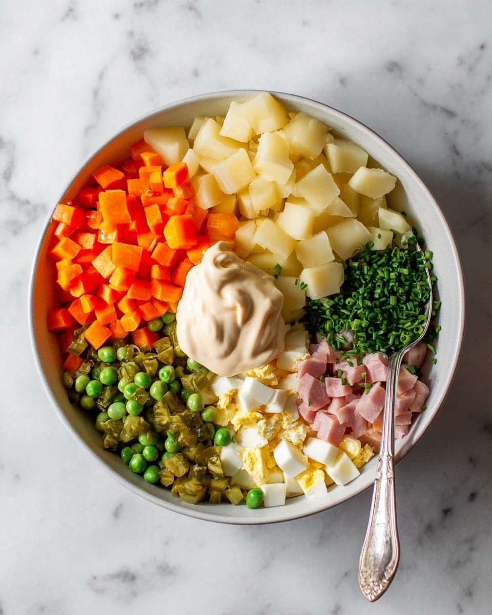 A white bowl filled with seven separate sections of ingredients on a white marbled surface: bright orange diced carrots at the top left, pale yellow diced potatoes at the top center, green peas on the right, small green chopped chives near the bottom center, white and yellow chopped boiled eggs on the bottom right, small light pink diced ham on the bottom left, and light green diced pickles on the left center. A large dollop of creamy off-white mayonnaise sits in the middle, and a spoon rests on the right side of the bowl. Photo taken with an iphone --ar 4:5 --v 7