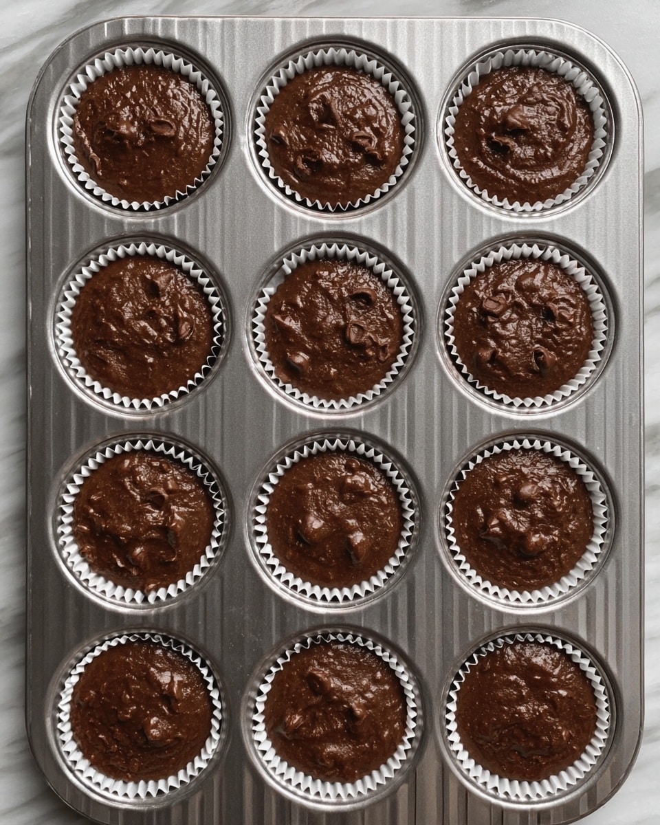 The image shows 11 baking ingredients arranged neatly on a white marbled surface. In the center is a white bowl filled with white flour. Surrounding it are small bowls in white and yellow: a white bowl with light yellow oil on the left, a yellow bowl with chocolate chunks at the bottom left, a white bowl with egg white near the bottom center, a yellow bowl with beige batter in the top right, and a white bowl with white salt near the bottom right. Above the flour bowl is a wooden bowl filled with white sugar. To the right of the sugar is a gold measuring cup filled with light brown sugar. Two dark, ripe bananas are placed vertically on the far right. At the bottom left is a brown egg, and near the egg is a small white bowl with amber liquid. Photo taken with an iphone --ar 4:5 --v 7