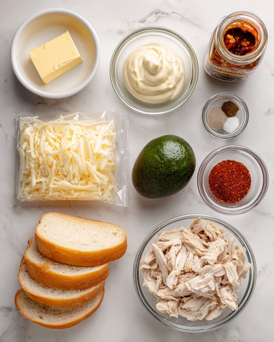 The image shows ingredients laid out on a white marbled surface: a small white bowl with a stick of butter in the top left, a clear glass bowl filled with mayonnaise next to it, and a whole dark green avocado beside the mayonnaise. Below these is a package of shredded Colby Jack cheese with several slices of light brown ciabatta bread stacked next to it. To the right, a jarred can of chipotle peppers sits above a small clear bowl of salt. Two small jars of garlic powder and chili powder are lined up above a large clear glass bowl filled with shredded cooked chicken. The arrangement is neat and all containers are clear or white, emphasizing the colors and textures of the food ingredients photo taken with an iphone --ar 4:5 --v 7
