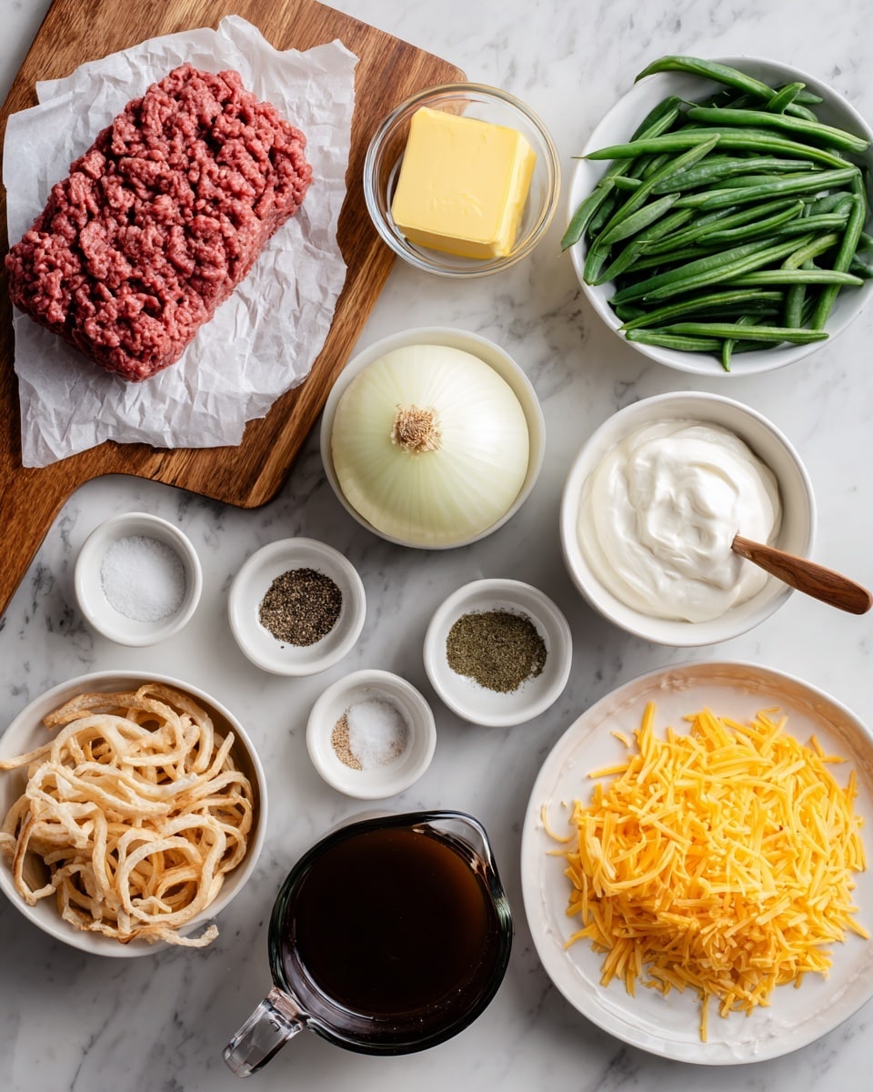 The image shows various ingredients arranged neatly on a white marbled surface, each in white bowls or clear measuring cups. On the top left, there is a wooden board with a piece of raw ground beef on white parchment paper, next to a small glass bowl with a pat of yellow butter. To the right, a white bowl is filled with green beans. Below, small white bowls hold different spices: black pepper, garlic powder, and onion powder on one plate, with salt in a bowl with a small wooden spoon nearby. A black bowl contains thick white sour cream, next to a white bowl full of crispy fried onion straws. In the center, a large white onion sits beside a glass measuring cup filled with dark brown beef broth and another with light cream labeled half & half. At the bottom right, a white plate holds shredded cheddar and mozzarella cheese side by side, with the cheddar cheese brightly orange and the mozzarella soft white. photo taken with an iphone --ar 4:5 --v 7