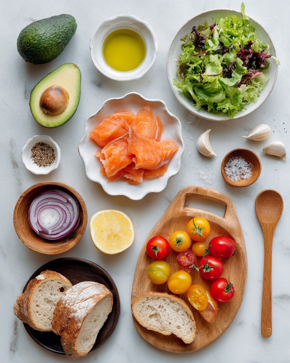 The image shows several ingredients arranged neatly on a white marbled surface. At the top left, a whole avocado and a half avocado with the seed are placed next to a small white bowl of fresh green mixed salad leaves. To the right, a white scallop-edged bowl is filled with bright orange smoked salmon slices. Below, a wooden board holds colorful sliced cherry tomatoes in red and yellow, along with a small cluster of whole cherry tomatoes still on the vine. Two peeled garlic cloves and a half lemon are placed near the board. To the bottom left, a small wooden bowl contains three rings of red onion slices. Near the center, a black plate holds two slices of rustic white bread, with a small brown bowl beside it filled with everything sprinkle seasoning. A small white bowl with a light yellow liquid, labeled avocado oil, is placed near torn bread pieces at the bottom left. A light wooden spoon with salt and pepper is on the right edge. Everything is set on a bright white marbled background, photo taken with an iphone --ar 4:5 --v 7