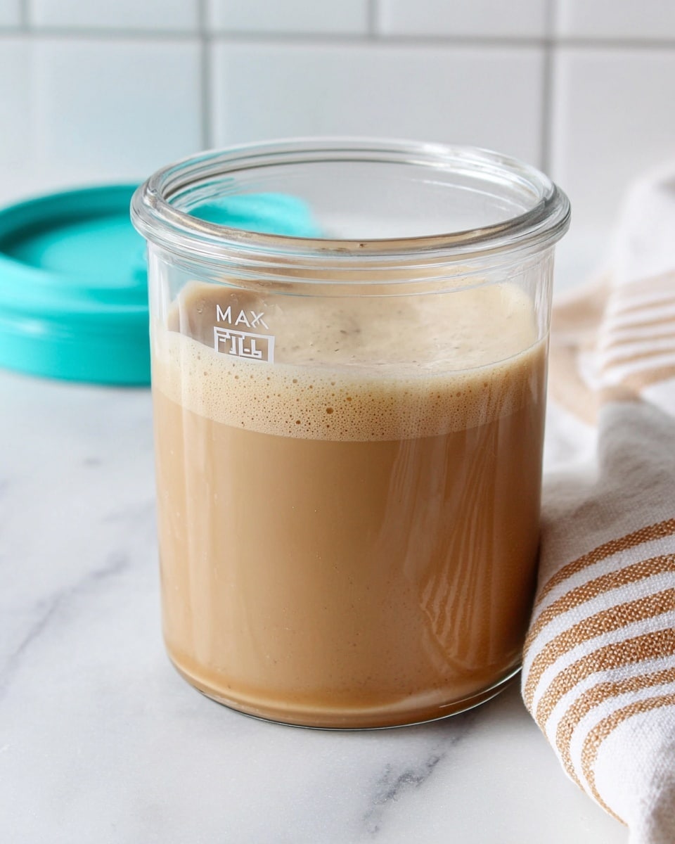 A clear glass container filled almost to the