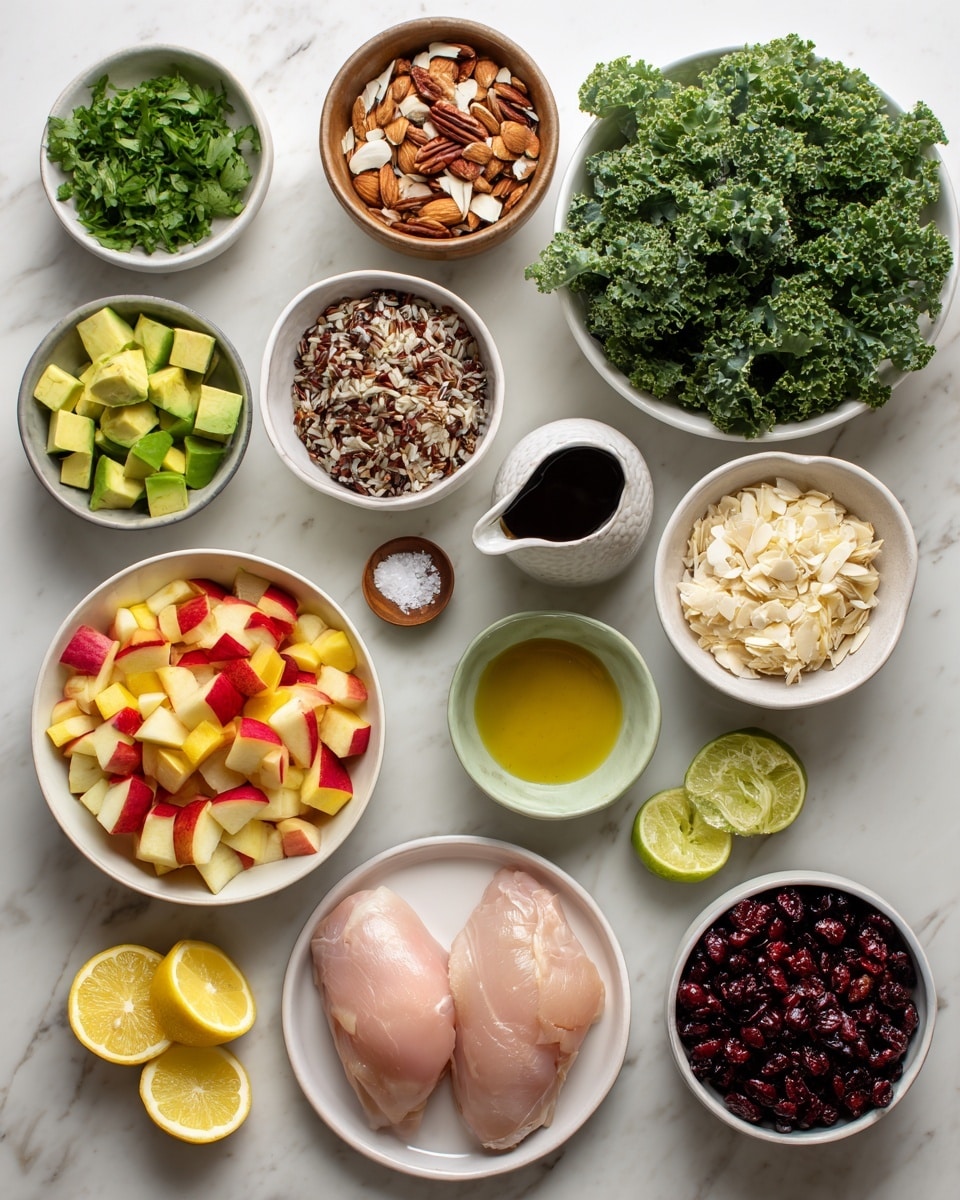 The image shows various fresh ingredients arranged neatly on a white marbled surface. At the center bottom is a white bowl filled with chopped red and yellow apple pieces, next to a small white bowl with salt and pepper, and slices of lime. To the right, there is a large white bowl with fresh green kale leaves and a small white pitcher of dark balsamic vinegar beside it. Above the kale is a small light green bowl containing diced avocado. Next to the avocado is a white bowl filled with mixed wild rice grains in shades of brown and black. Above the rice is a small white bowl with bright green cilantro leaves. To the left of the cilantro is a clear glass container of olive oil. Below the olive oil is a white bowl full of dark red dried cranberries. At the center left, a white plate holds two raw pale pink chicken pieces. Small dishes around include a fluted white bowl with pale yellow Dijon mustard, a brown bowl with sliced almonds, a small white bowl filled with crumbly white goat cheese, and a tiny glass container of amber maple syrup. Two lemon halves sit near the chicken on the left side. The overall layout is clean, bright, and colorful, with a focus on fresh ingredients. Photo taken with an iphone --ar 4:5 --v 7