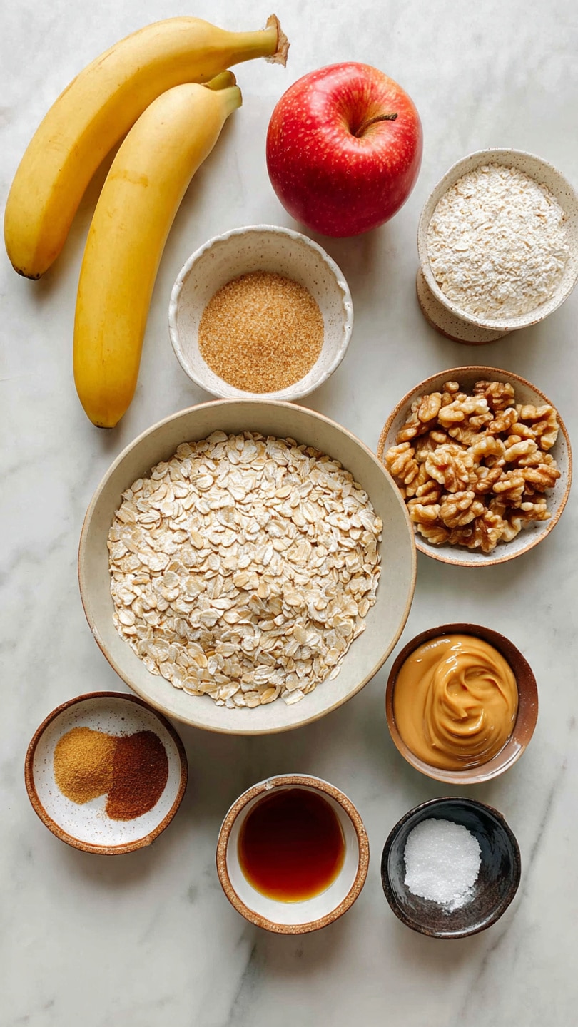 A top-down view of old-fashioned oatmeal ingredients arranged neatly on a white marbled surface. In the center is a large bowl filled to the top with light beige rolled oats, with a slightly rough texture. Surrounding it are smaller dishes and items: to the top left, two yellow bananas; to the left of the bowl, a red apple and a small rustic bowl of brown sugar with a crumbly texture; below that, a small white and brown plate holding a small pile of cinnamon powder; a small cup of maple syrup below that with a smooth dark amber surface; to the top right, a scalloped bowl with walnut pieces showing rough, uneven tan and light brown textures; a small bowl of peanut butter with a creamy tan surface next to it; a glass measuring cup of clear water just below the peanut butter; and a small dark bowl with a pinch of white salt near the bottom right corner. The scene is bright and clear. photo taken with an iphone --ar 4:5 --v 7