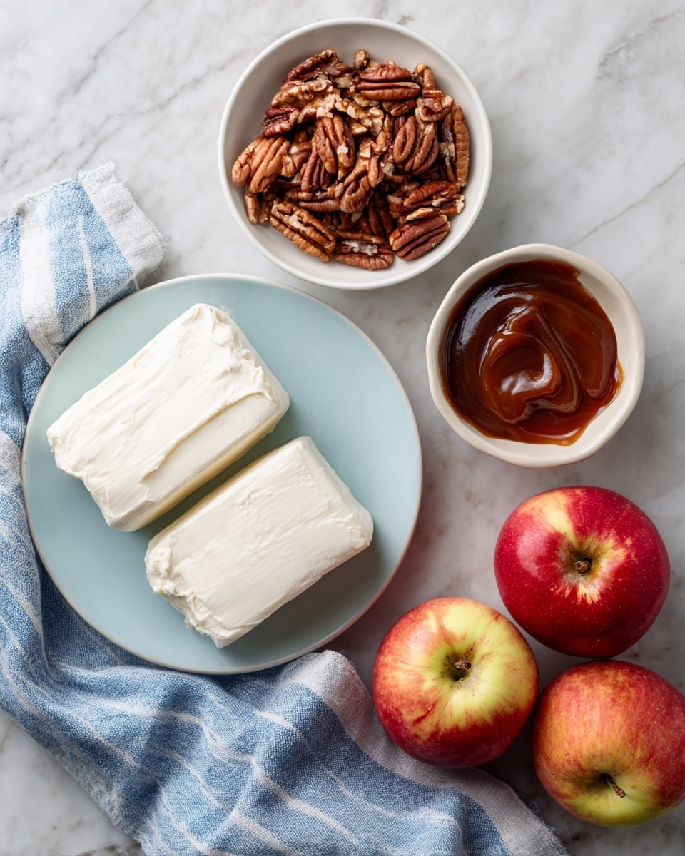 The image shows four main ingredients placed on a white marbled surface. In the bottom left, there is a light blue plate holding two thick blocks of smooth, white cream cheese. Above it, there is a small white bowl filled with whole pecans, which are brown and have a textured surface. To the right of the pecans, another small white bowl contains rich, glossy caramel sauce with a dark amber color. In the bottom right corner, there are three red apples with some yellowish patches, resting on a blue and white striped cloth that partially covers the surface. The photo taken with an iphone --ar 4:5 --v 7