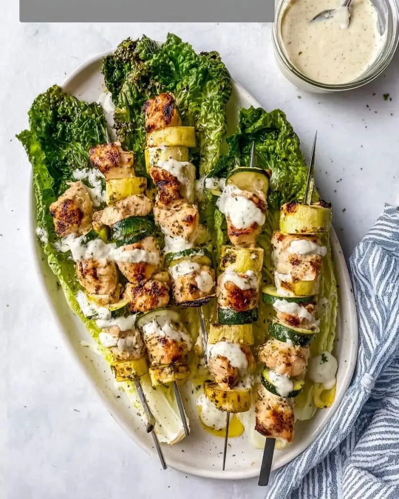 Caesar-Marinated Chicken Kabobs with Zucchini and Grilled Romaine Recipe