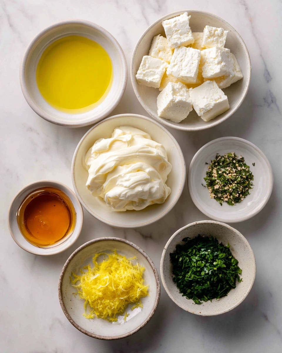 Six small white bowls are arranged on a white marbled surface, each filled with different ingredients. The top right bowl contains white and crumbly feta cheese cubes. Below it, at the center, a bowl holds smooth, creamy white cream cheese. To the left, a bowl with golden yellow olive oil has a shiny liquid texture. Below that, a bowl filled with amber-colored honey looks thick and glossy. At the bottom left, a small bowl contains bright yellow lemon zest with a fine, textured look. Finally, to the right of the honey, a bowl contains dark green fresh herbs with a chopped appearance. Photo taken with an iphone --ar 4:5 --v 7