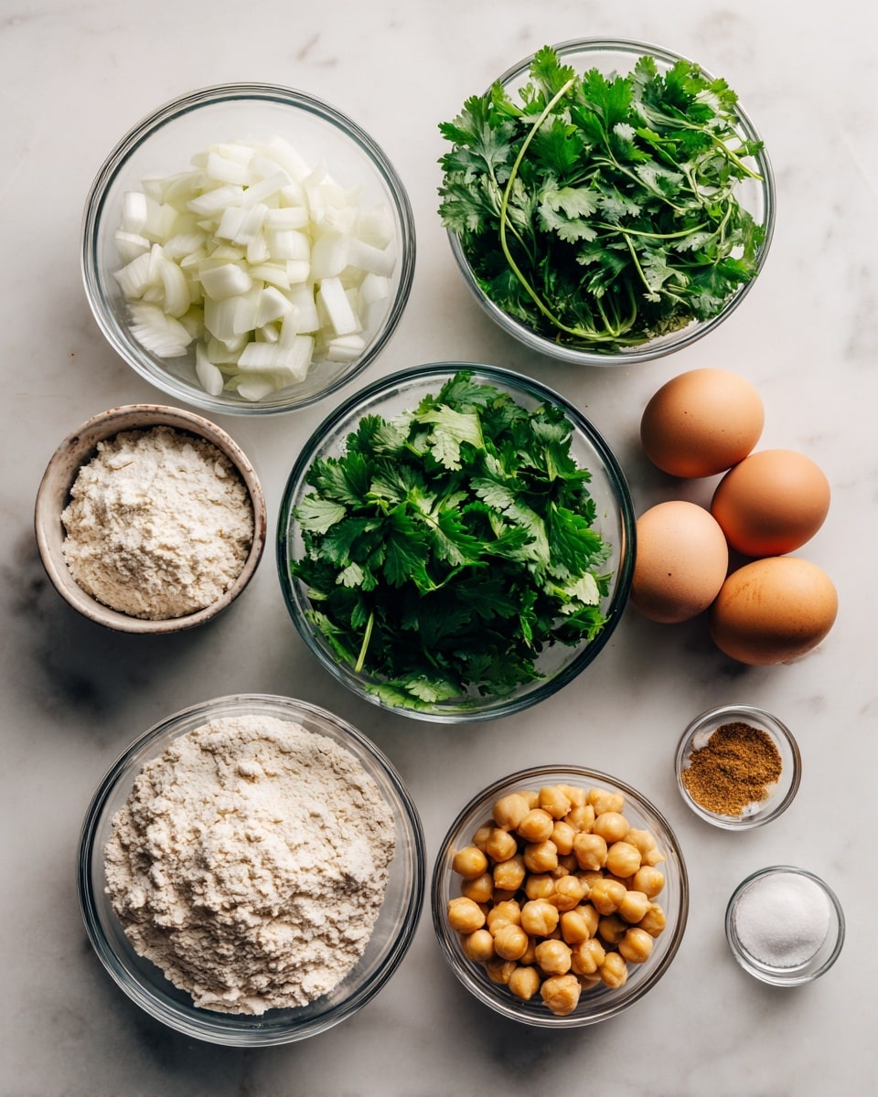 The image shows nine clear bowls of different sizes arranged on a white marbled surface. Starting from the top left, there is a small bowl filled with small pieces of white onion. To the right, a small bowl holds three brown eggs. Below the onion, a medium bowl is piled with fresh, green parsley leaves, and next to it, another medium bowl contains fresh cilantro leaves. Below the parsley, there's a medium bowl filled with light beige flour, and next to it, a medium bowl has light yellow canned chickpeas. At the bottom, from left to right, there are three small bowls; one with white salt, one with minced garlic, and one with light brown cumin powder. The photo taken with an iphone --ar 4:5 --v 7