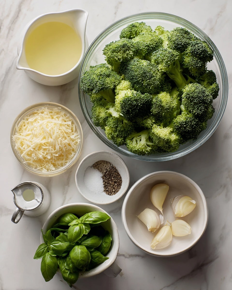The image shows ingredients for a recipe placed on a white marbled surface. In the center is a clear glass bowl filled with bright green broccoli florets. Above it is a small white bowl filled with light yellow grated parmesan cheese. To the left of the cheese is another white bowl with pale yellow lemon juice. To the right of the cheese is a small white bowl that holds white salt and black pepper side by side. Below and to the right is a small white bowl with two peeled garlic cloves. Below and to the left is a white metal measuring cup filled with fresh green basil leaves. On the far left side, there is a white olive oil dispenser. The setup is clean and organized, showing fresh and simple ingredients. Photo taken with an iphone --ar 4:5 --v 7