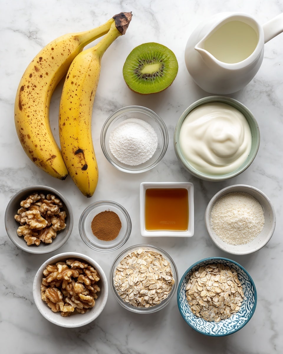 The image shows various ingredients arranged separately on a white marbled surface. At the top left, there are two yellow bananas, one with brown spots, next to a whole kiwi fruit and one cut in half showing its green inside. To the right, a small white bowl holds creamy white coconut yogurt. Below, a small white square dish contains amber maple syrup. Moving down, there is a small round white bowl with white baking powder, and to the left, a gray bowl filled with walnut pieces. A small glass container has light brown flax seeds, near a tiny white round dish with cinnamon powder. A clear glass bowl at the bottom left is full of pale oats, while the bottom right has a white bowl with blue patterns containing vanilla protein powder. At the top left of the walnuts, a white milk jug holds soy milk. Each ingredient is labeled with simple black text. photo taken with an iphone --ar 4:5 --v 7