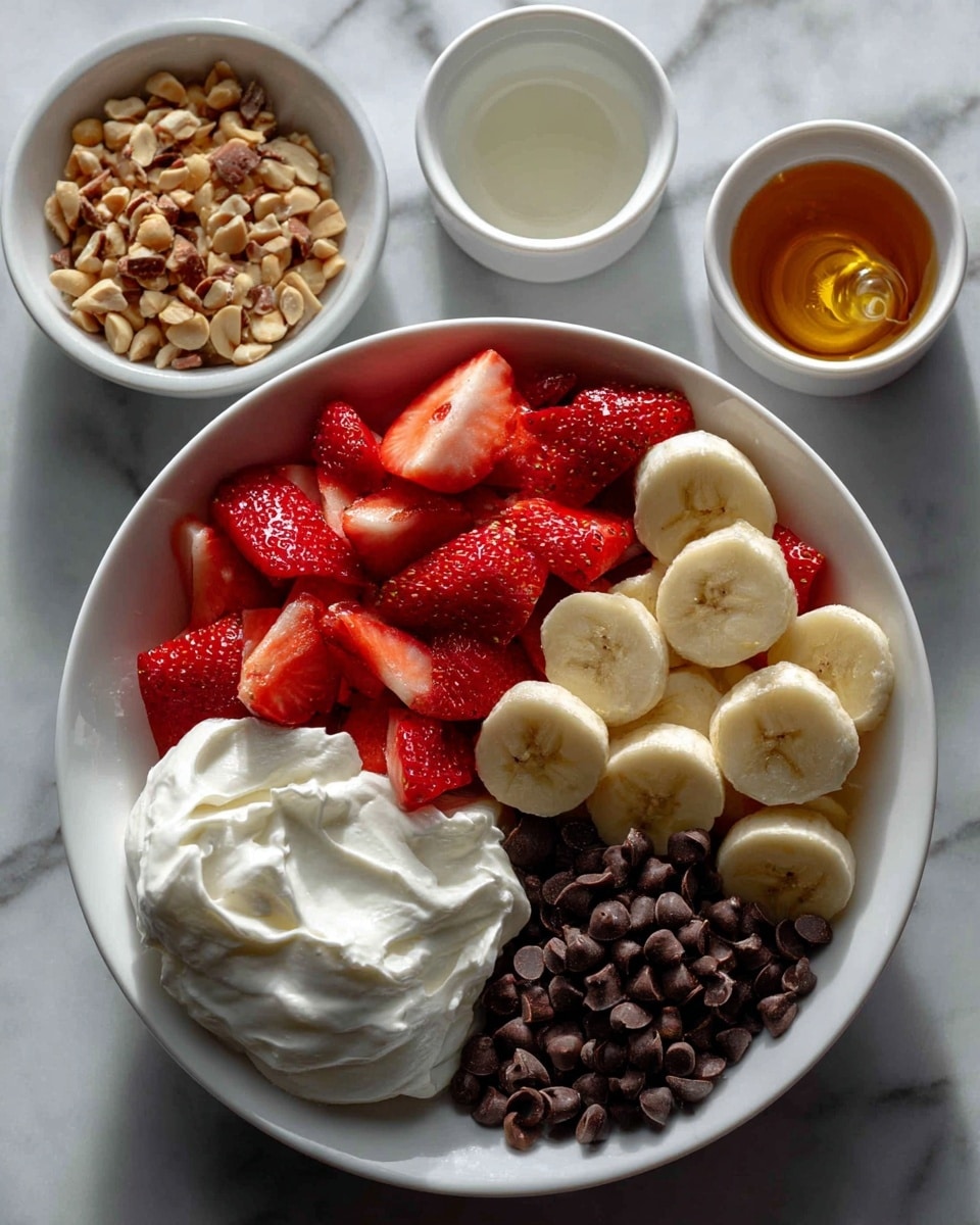 A white bowl filled with two layers of fresh fruit: bright red chopped strawberries on the left and light yellow sliced bananas on the right. Around the bowl on a white marbled surface are five small white bowls and dishes holding different ingredients: a small clear glass bowl with golden honey at the top right, a small oval white dish with roasted and salted peanuts below it, a white jug filled with thick plain Greek yogurt at the bottom left, a white small bowl with creamy white coconut oil to the right of the peanuts, and a white bowl filled with dark brown chocolate chips at the bottom right. All items are spaced neatly and evenly, giving a clean and fresh look. photo taken with an iphone --ar 4:5 --v 7