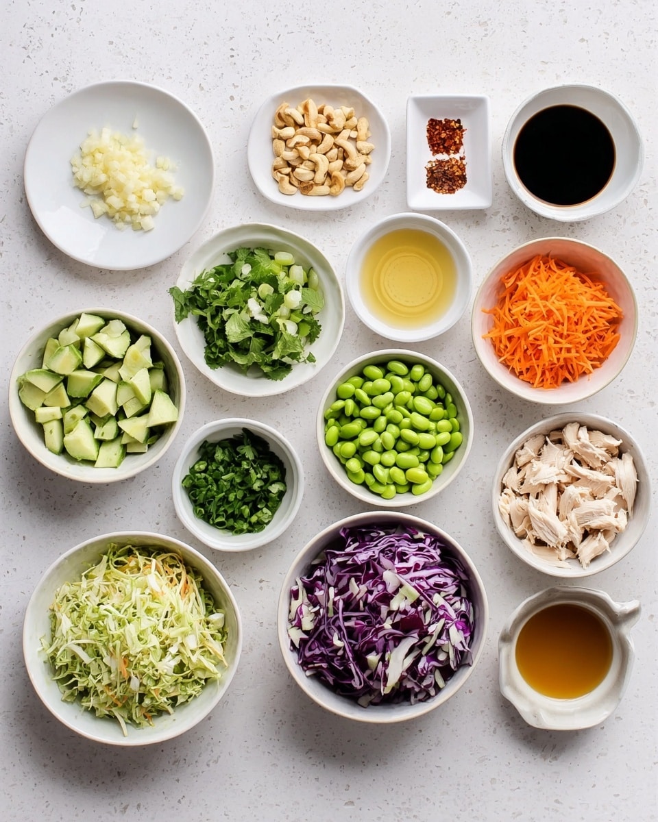 In this image, there are many small white bowls and plates arranged neatly on a white marbled surface, each containing different ingredients. From top to bottom and left to right, you see a white plate with minced garlic, a small white bowl with grated ginger, a tiny white plate with red spices, a white measuring cup with chopped nuts, a small white bowl with chopped cilantro, another white bowl with honey, and a white bowl with diced avocado. Below them are bowls filled with soy sauce, olive oil, sliced green onions, shredded cabbage mixed with small pieces of purple cabbage, cucumber chunks, chopped mint, shredded orange carrots, shredded chicken, a white measuring cup with edamame beans, a white bowl with vinegar, and a small bowl with a light brown liquid. Everything is clearly separated and clean, showing fresh and colorful ingredients. Photo taken with an iphone --ar 4:5 --v 7