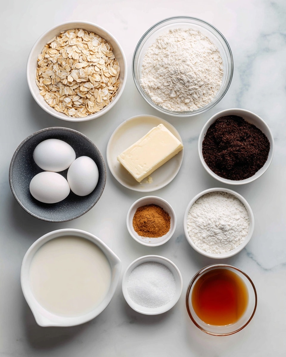 The image shows various baking ingredients neatly placed on a white marbled surface. From top left to right, there is a white bowl filled with old fashioned oats, a clear glass bowl full of all purpose flour, a stick of butter with blue markings, and a white bowl with white sugar. Below, a small dark gray bowl holds two white eggs. Nearby, a small white bowl contains ground cinnamon, and beside it is a white bowl filled with dark molasses. Further down on the right side, there are two small white bowls, one with kosher salt and the other with baking soda. Below this group is a separate section labeled