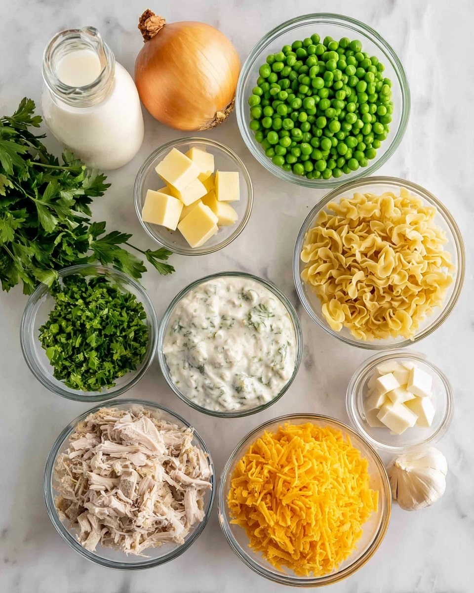 The image shows several clear glass bowls arranged on a white marbled surface, each holding different ingredients. From top right clockwise: a bowl filled with bright green frozen peas, a bowl of thick white sauce with visible herbs, a whole yellow onion with papery skin, two cloves of garlic next to fresh green parsley leaves, a small bowl with light yellow butter cubes, a bowl with chopped green celery, a pile of uncooked yellow egg noodles, a bowl of crushed golden corn flakes, a bowl containing yellow shredded cheese, and finally a bowl with shredded cooked turkey meat. A glass bottle with milk and additional parsley leaves are placed at the top left. Photo taken with an iphone --ar 4:5 --v 7
